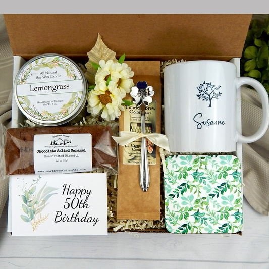 50th birthday gift basket with a personalized name mug, coffee, and delicious goodies.
