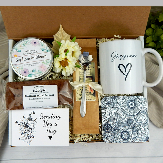 Sending hugs: Customized mug, coffee, and goodies in an encouragement gift basket for her.