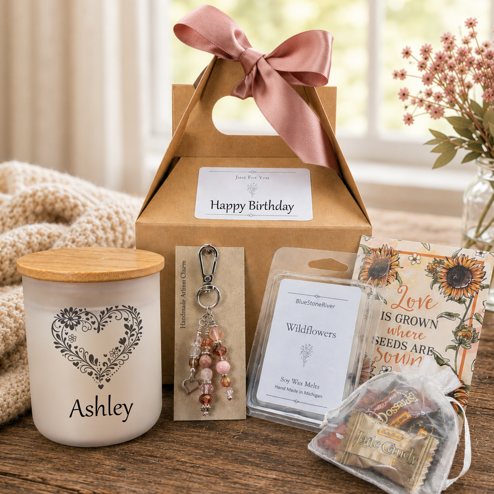 Birthday gift set with candle, artisan purse charm, seeds and candies on a wooden table