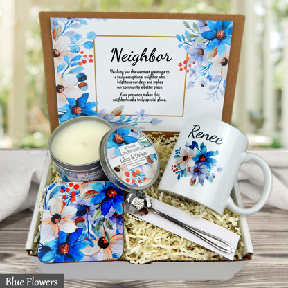 Gift set with candles, mug, and card in a box with blue floral design