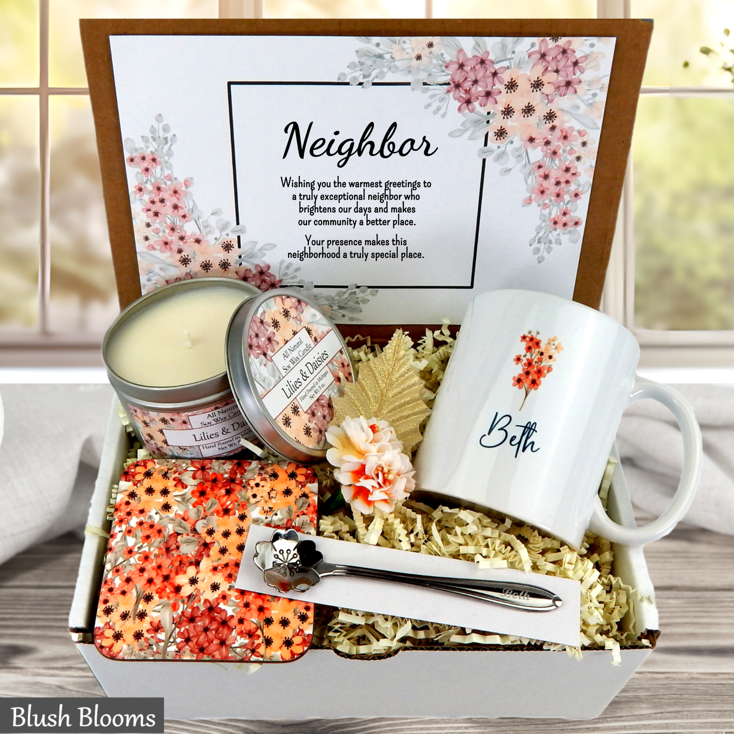 Neighborhood gift set with mug, candles, and coasters in a decorative box.