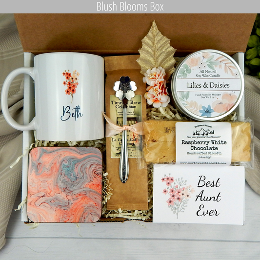 Aunt's Coffee Bliss: Women's gift basket with personalized mug, coffee, treats, engraved spoon, and candle.