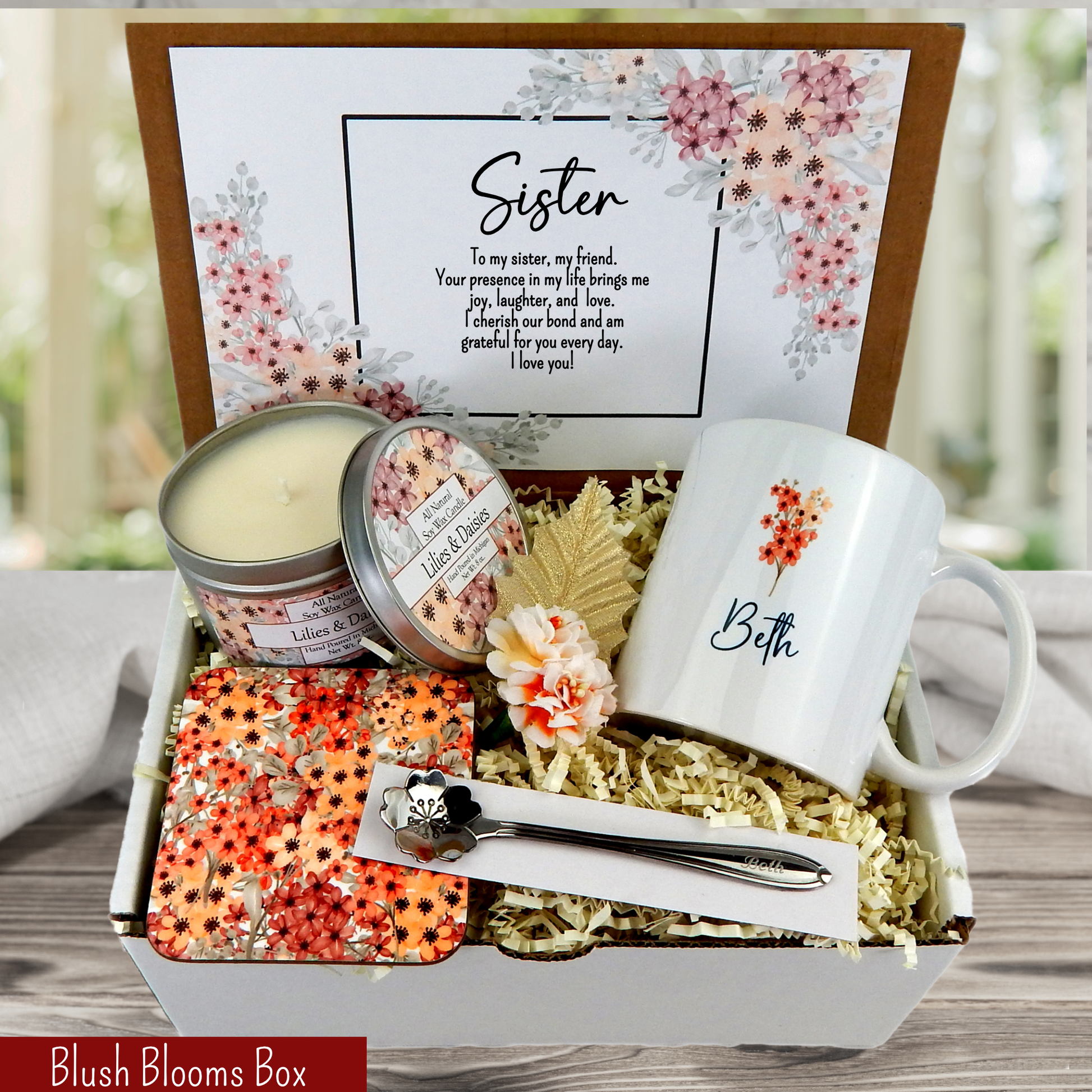 Unique sister's gift basket: custom mug, engraved spoon, coaster, candle, and special message. The pattern is blush colored flowers.