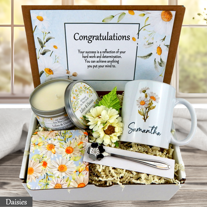 Daisy Gift set with mug, candle, and flowers in a decorative box with a 'Congratulations' card.