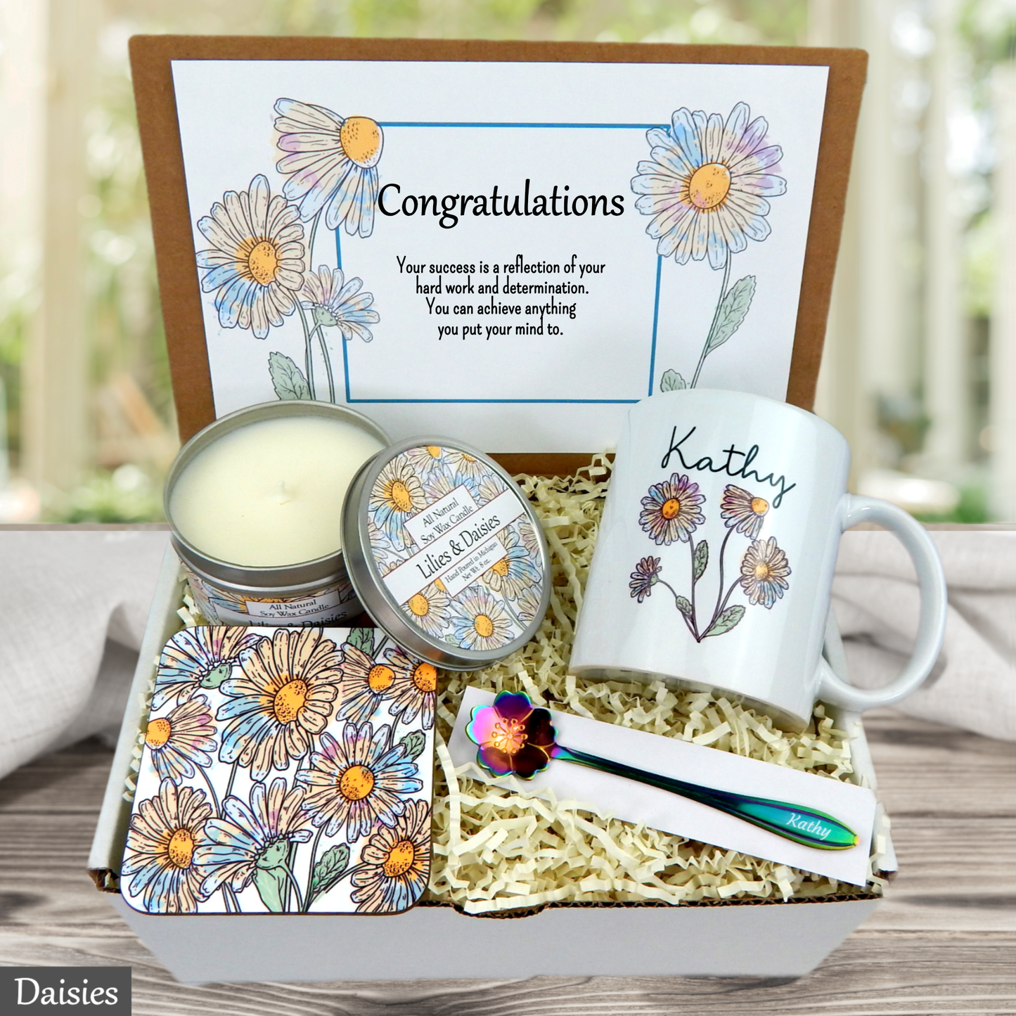 Colorful daisy Gift set with mug, candle, and stationery items in a box with 'Congratulations' card.