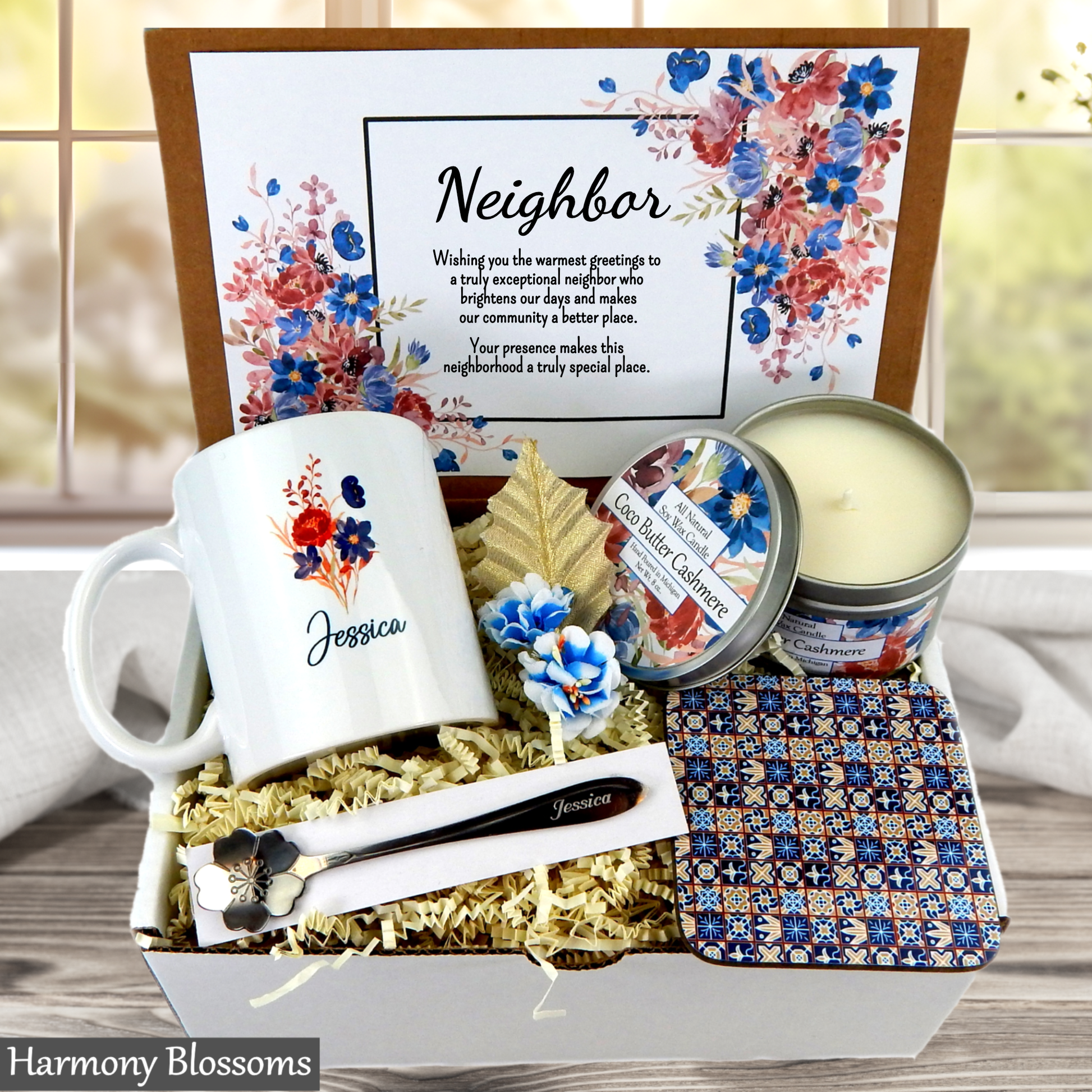 Neighbor gift set with mug, candle, and decorative items in a box.