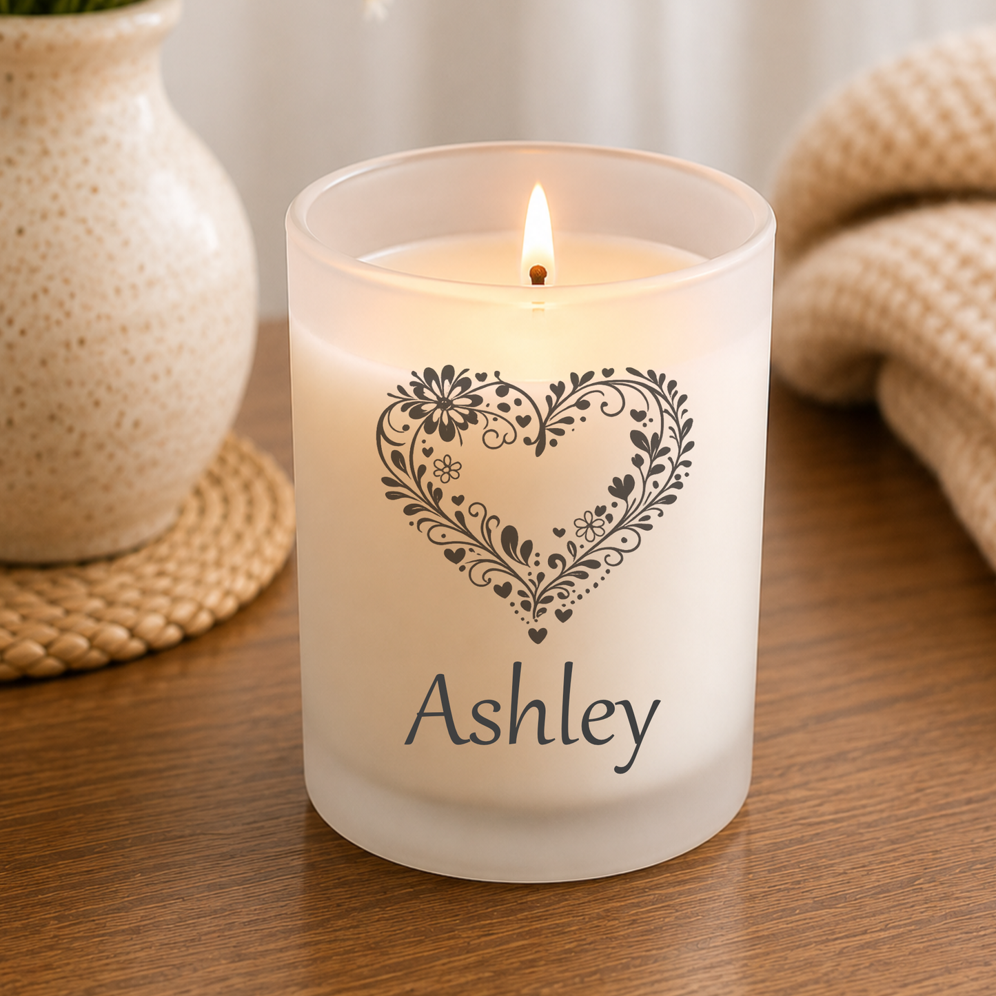 Candle with Personalized Name and heart design on a wooden surface