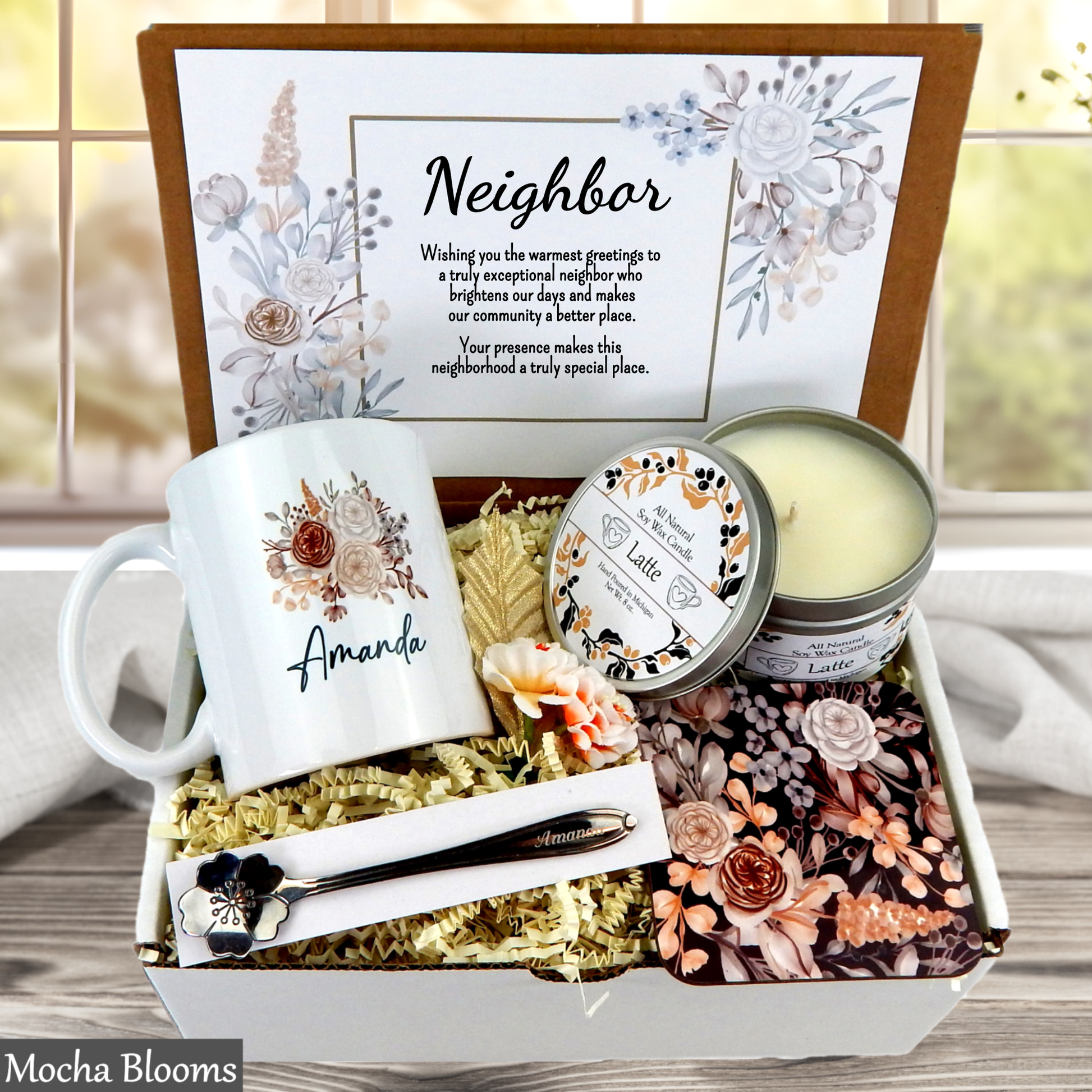 Gift box with mug, candle, and other items for a neighbor, featuring personalized text.