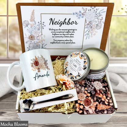 Gift box with mug, candle, and other items for a neighbor, featuring personalized text.