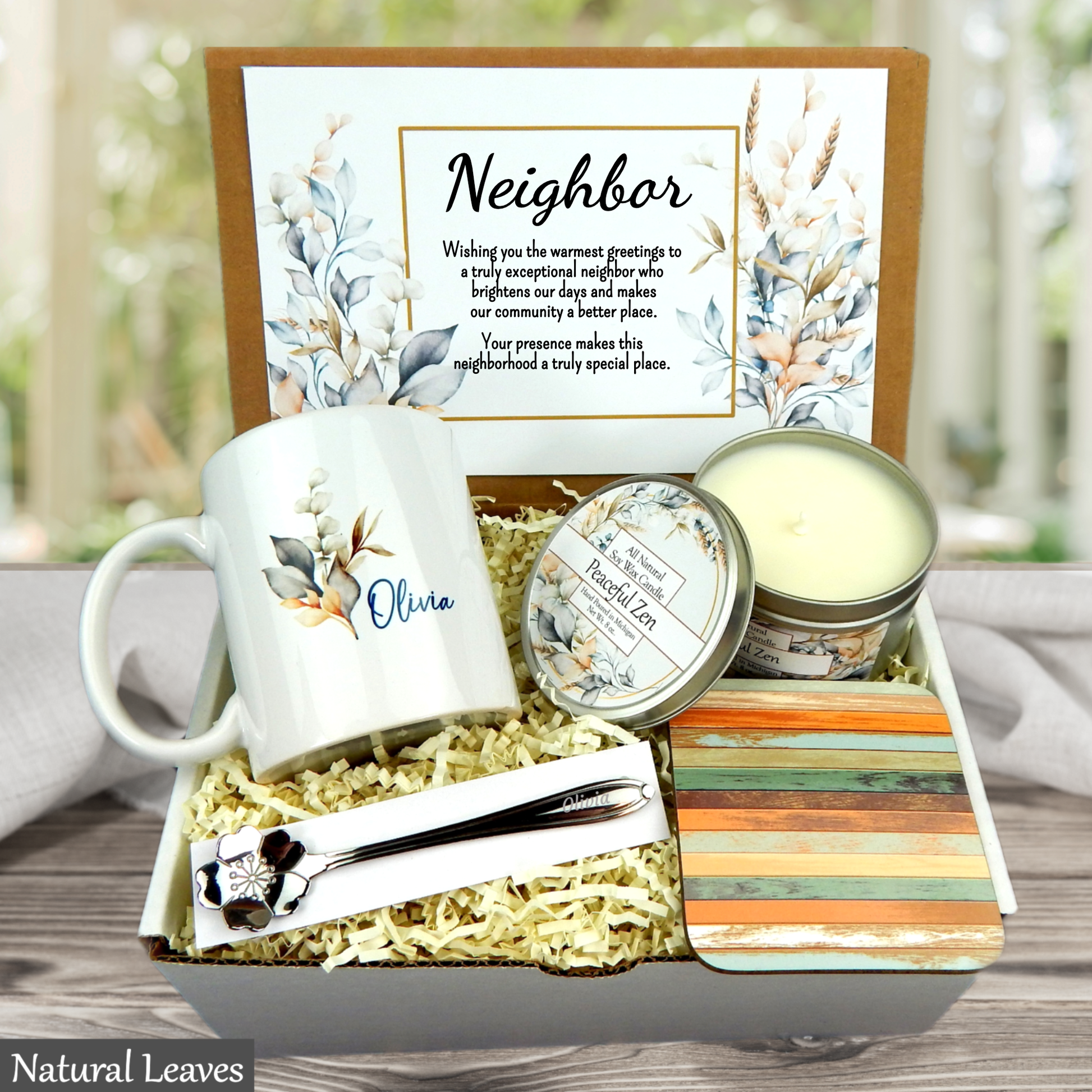 Neighbor gift set with mug, candle, and card on a wooden surface