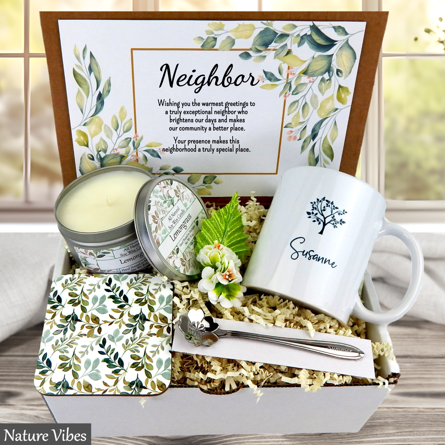 Neighborhood gift set with mug, candle, and coasters in a box, featuring a personalized message.