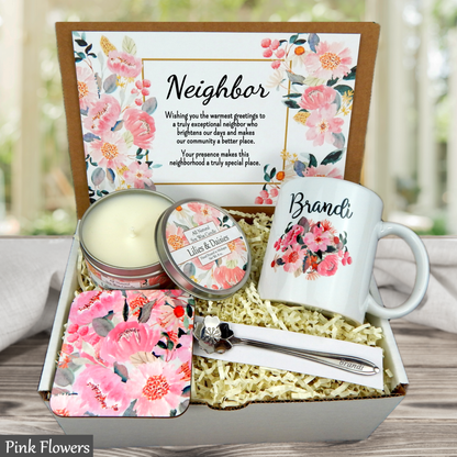 Gift set with mug, candle, and other items in a decorative box with floral design and 'Congratulations' message.