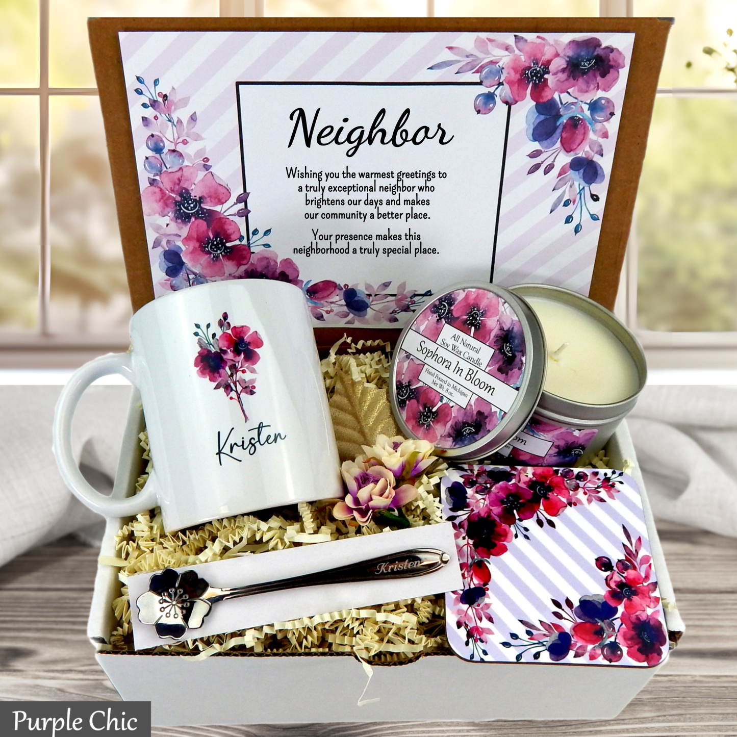 Neighbor gift set with mug, candle, and other items in a decorative box.