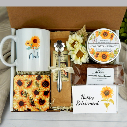 Sunflower themed Celebrating Retirement: Personalized name mug, coffee, goodies, engraved spoon, and candle in a care package gift basket for women.