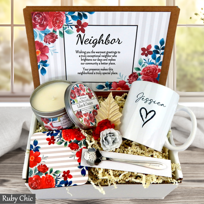 Neighborhood gift set with mug, candle, and stationery items in a decorative box.