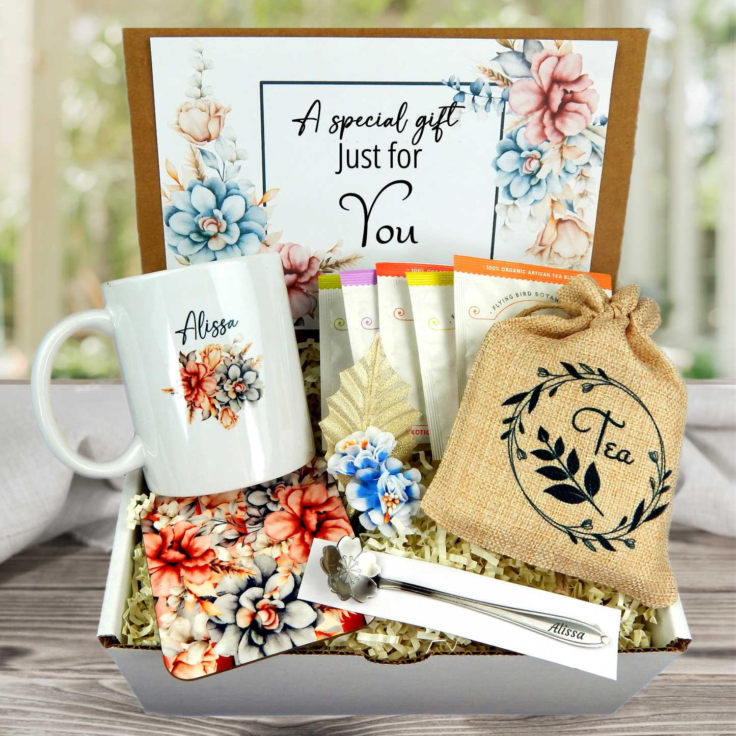 Gorgeous floral print Personalized mug and engraved spoon set accompanied by a large 8-ounce scented candle, an assortment of five artisan teas, and a matching coaster set for women