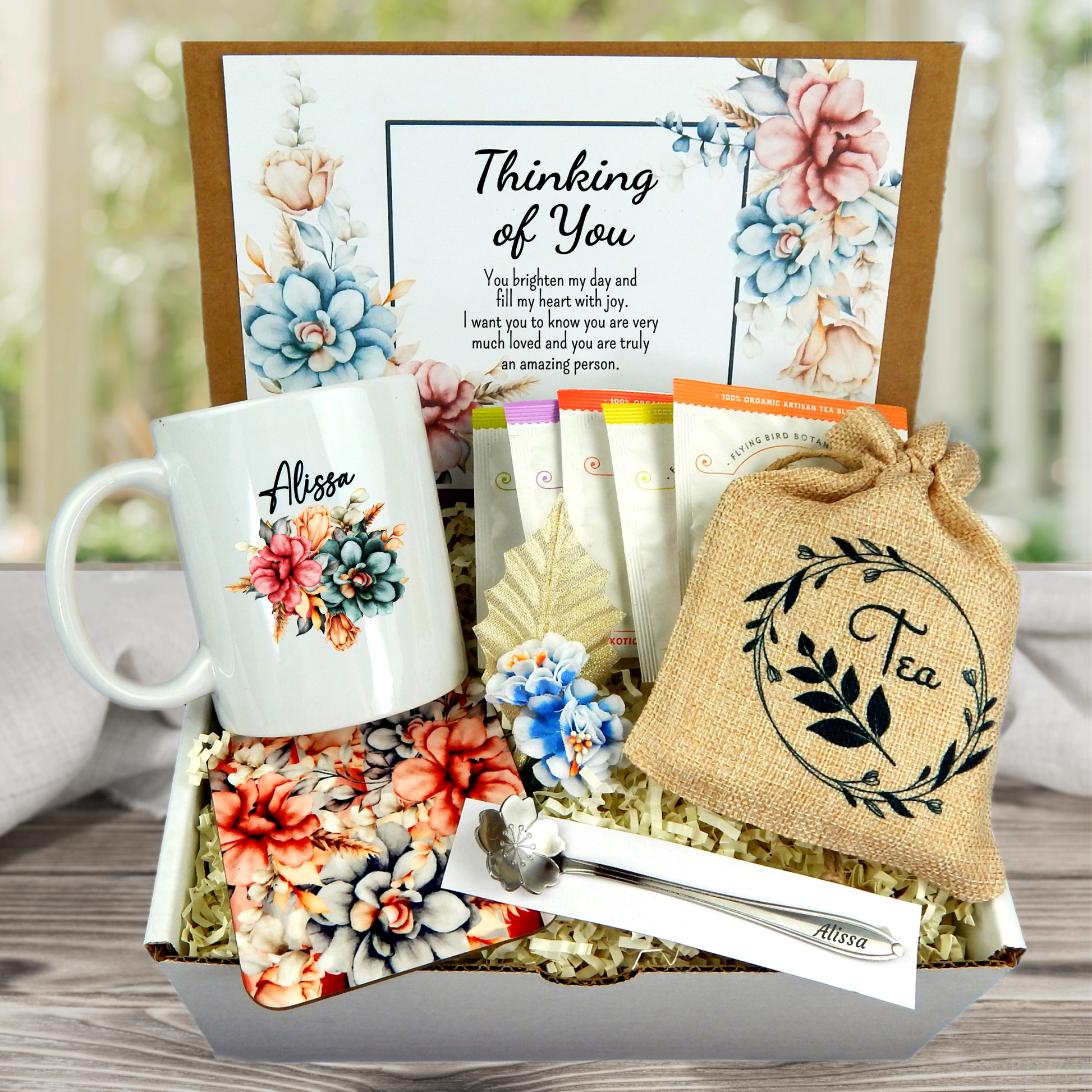thinking of you care package with Customized mug, tea sampler, coaster, personalized card with floral motif