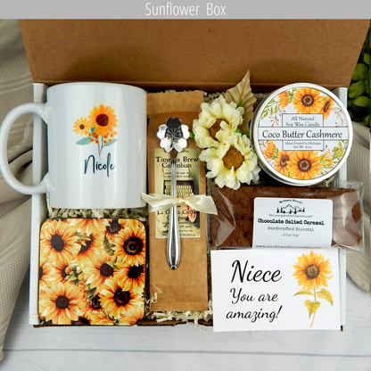 Show your love: Care package for your niece with a personalized name mug, coffee, comforting goodies, engraved spoon, and candle with sunflower theme.