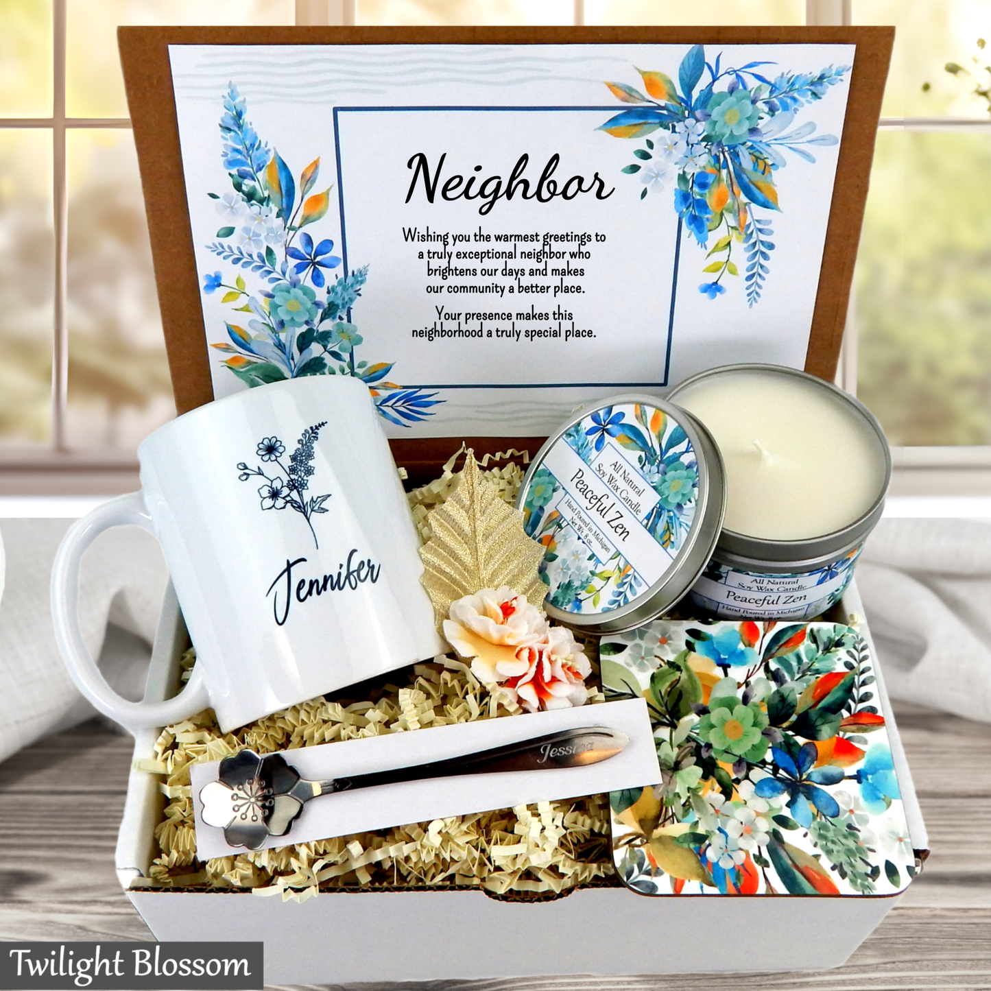 Neighbor gift set with mug, candles, and other items in a decorative box.