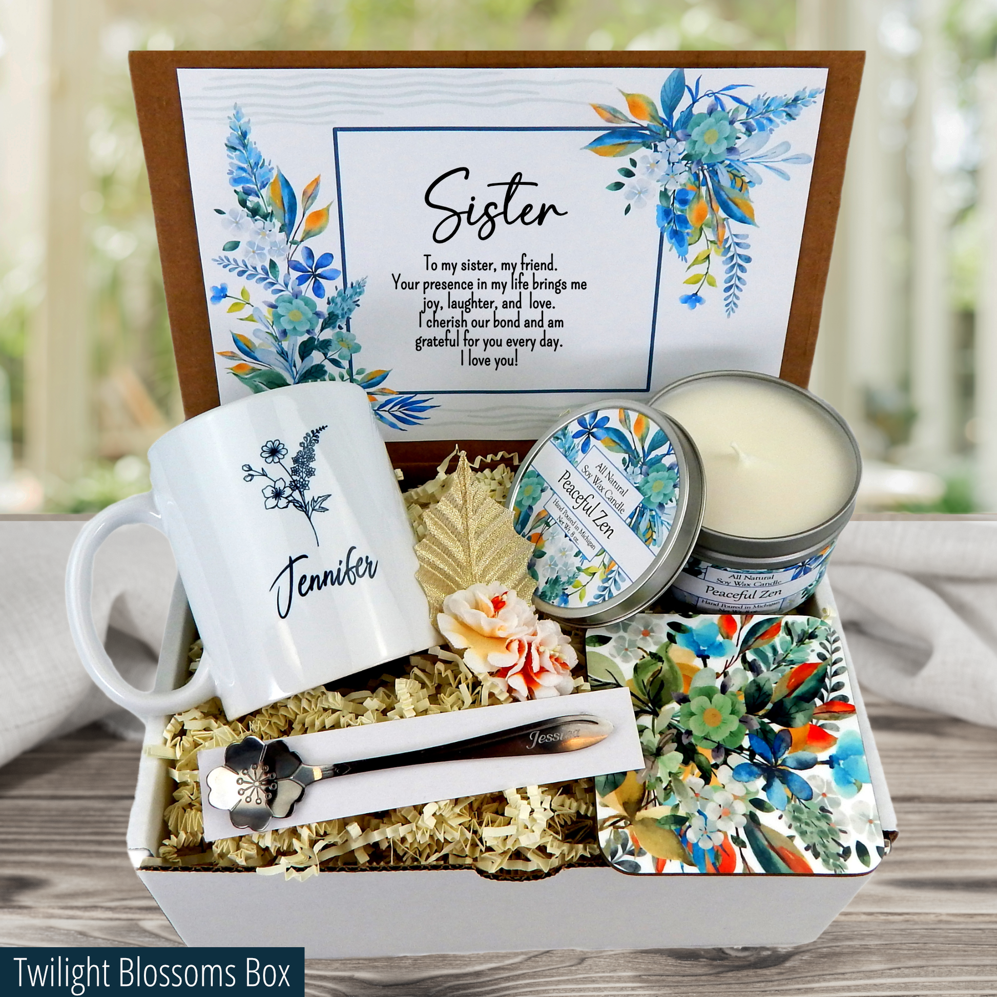 Celebrate sisterhood with a special gift basket: custom mug, engraved spoon, coaster, candle, and sisterly message.