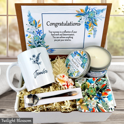 Gift box with mug, candles, and other items with 'Twilight Blossom' branding.