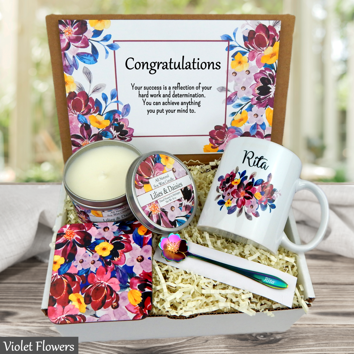 Gift set with candle, mug, and other items in a decorative box with 'Congratulations' message.