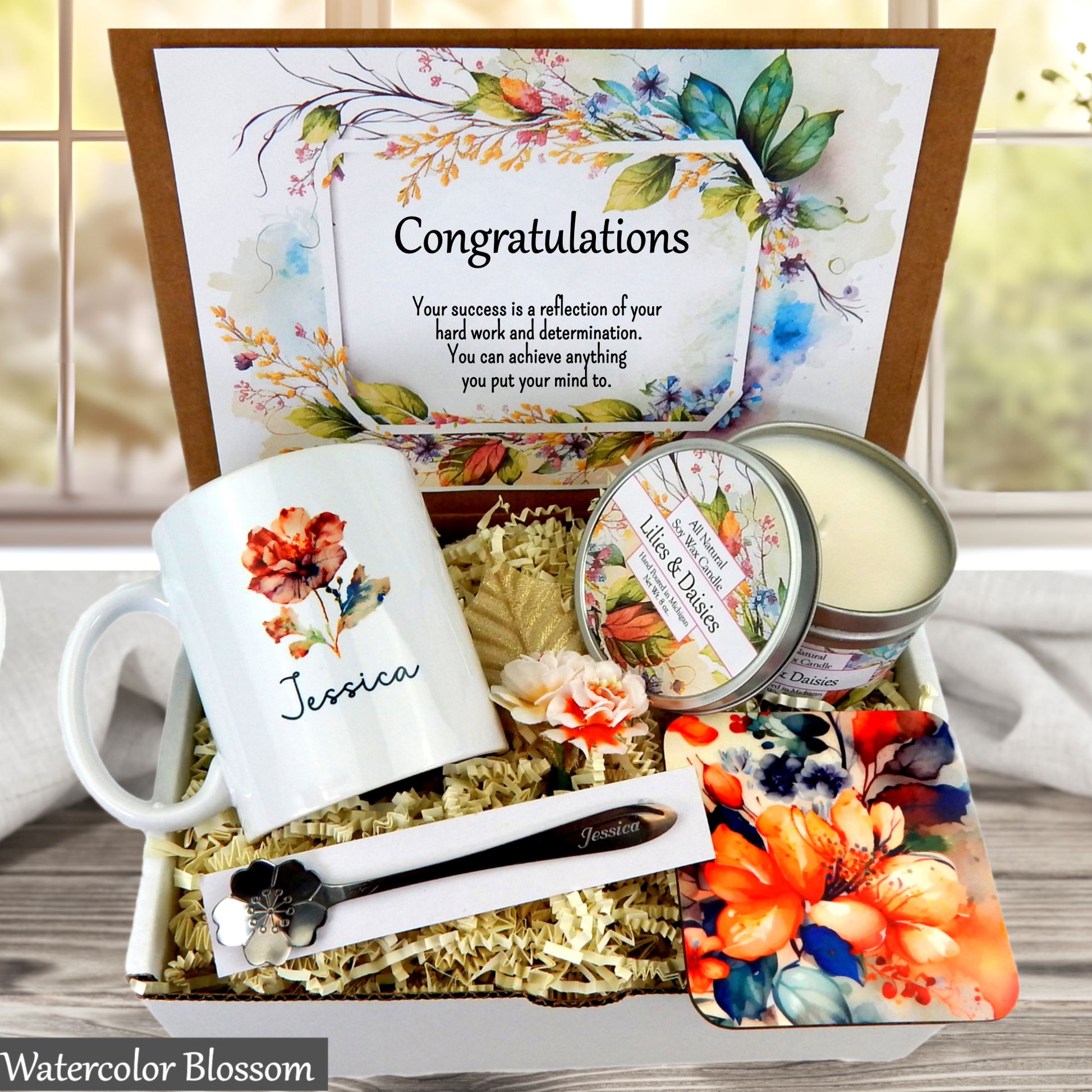 Gift set with mug, candles, and card in a decorative box with 'Congratulations' message.
