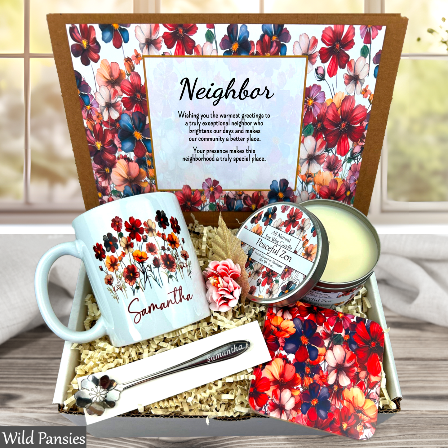 Neighborhood gift set with mug, candles, and cards featuring floral designs and text.